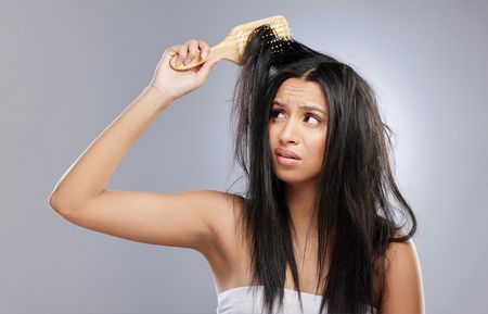 What are a Few Causes and Treatments for Postpartum Hair Loss?